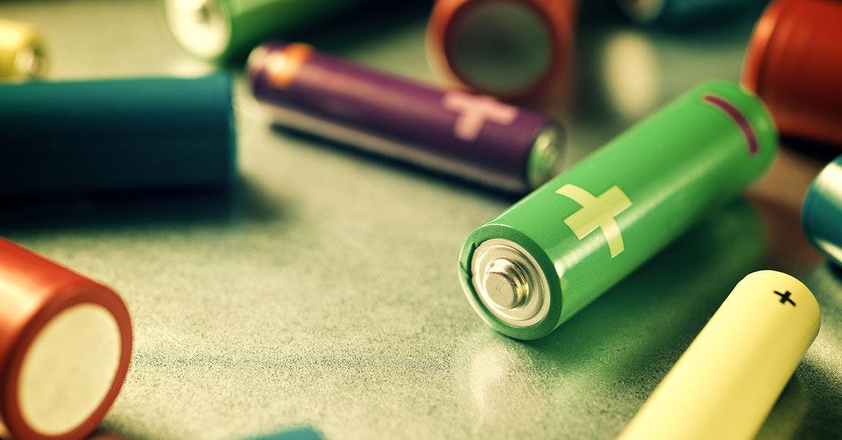 A group of colorful batteries on a table.