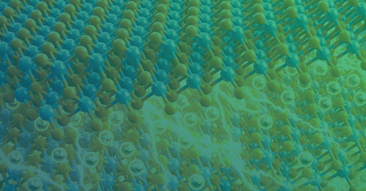 A close-up of a colorful, abstract representation of atomic structures with blue and green atoms interconnected by lines.