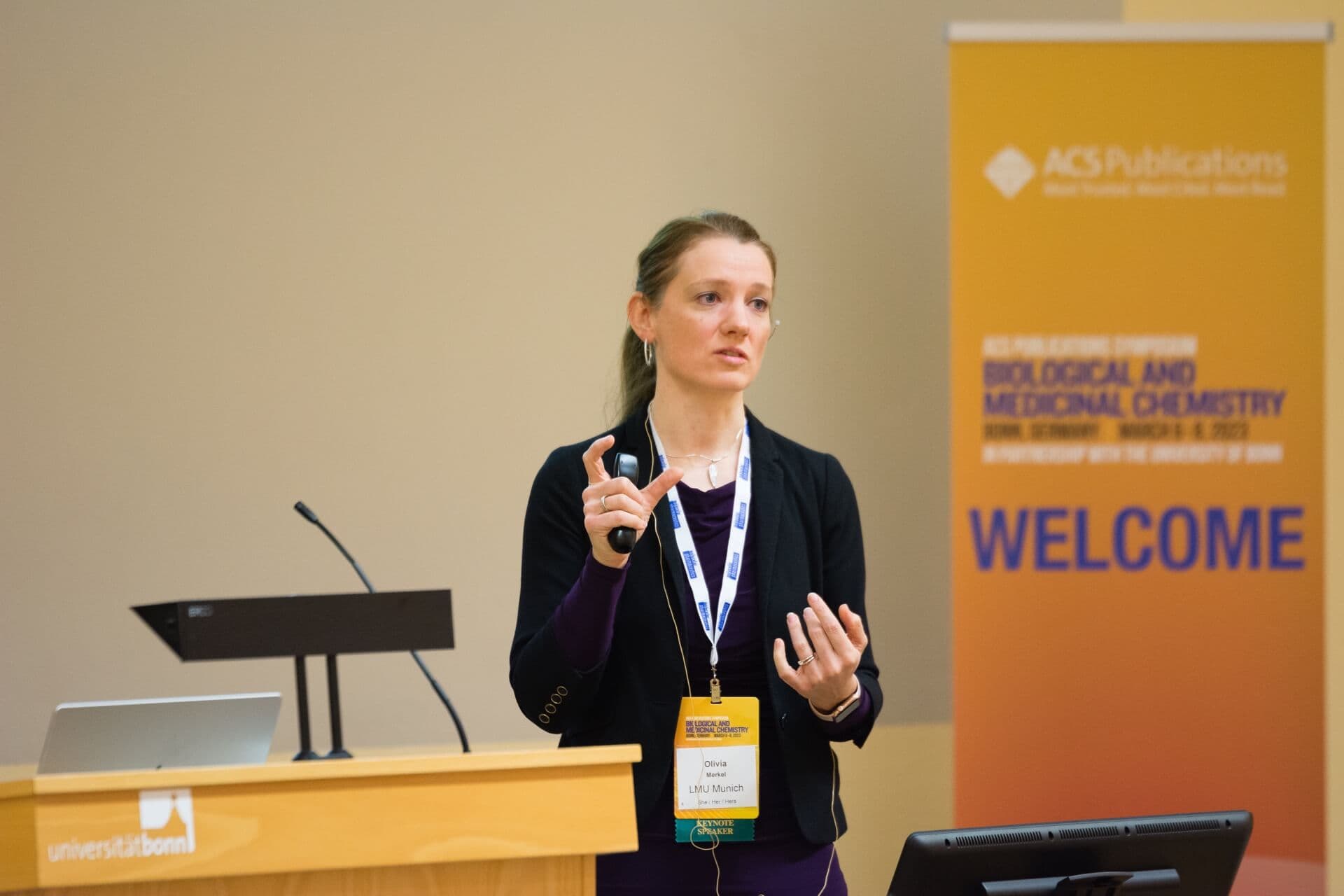 A speaker presenting at the Bonn Symposium
