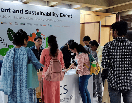 ACS booth surrounded by event attendees