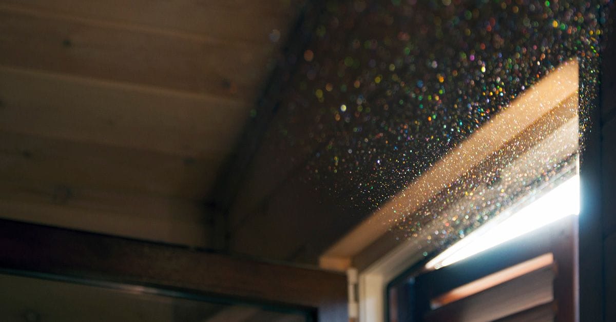 A light shining through a window in a room.