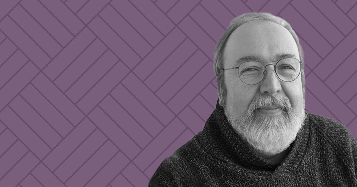 Headshot of Harold Linnartz on a mauve background