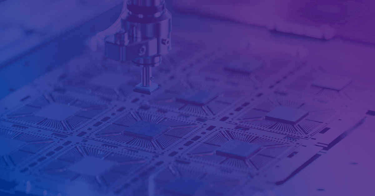 A robotic arm positioned above a grid of computer chips.