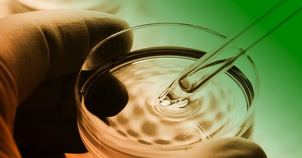 A person is holding a glass of water.