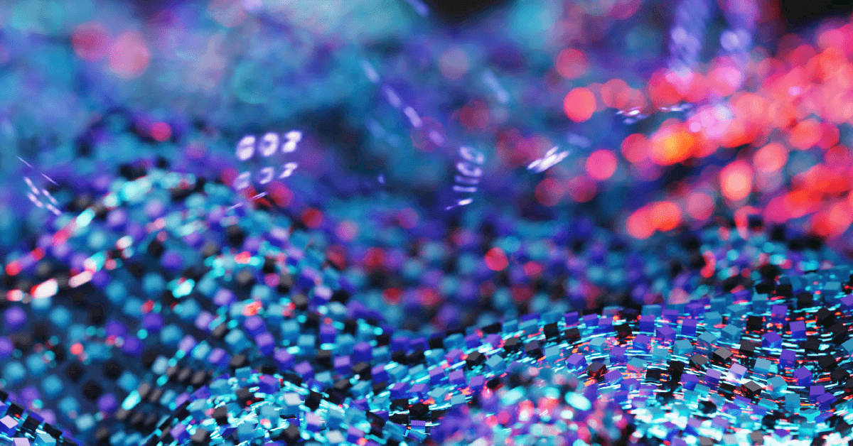 Macro view of shimmering, pixel-like fragments and bokeh lights in blue, cyan, magenta, and red, forming a textured abstract surface
