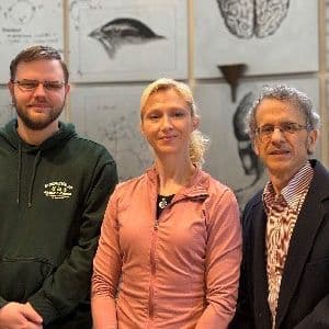 A photo of Dr. Renier van Neer, Dr. Trish Dranchak, and Dr. James Inglese